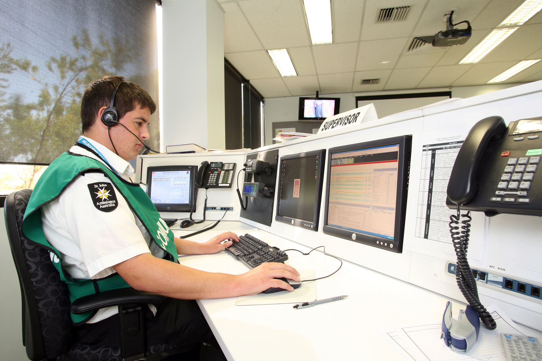 st john first aid at events volunteer working in control centre