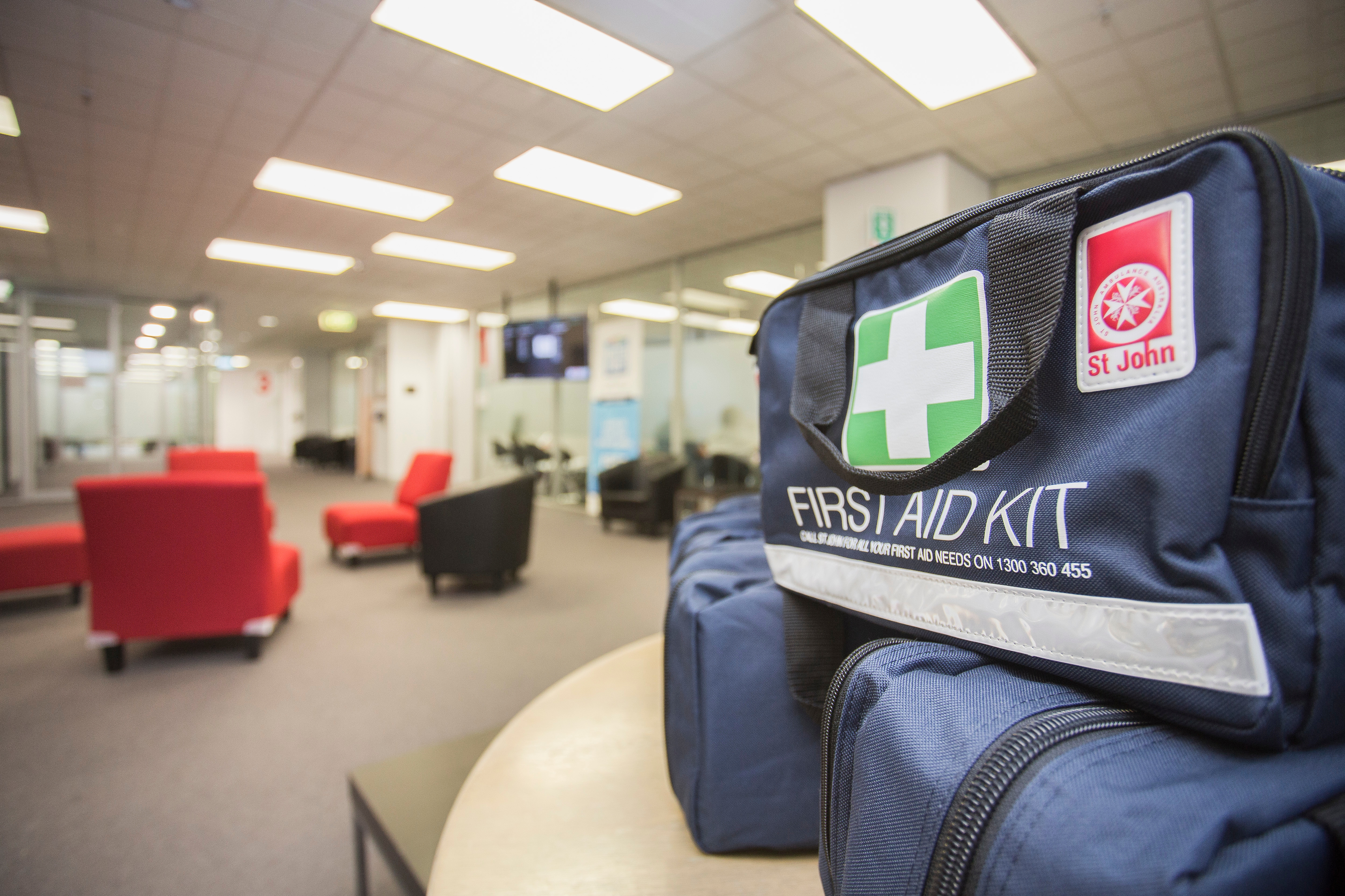 St John Medium First Aid Kit products on table in training venue