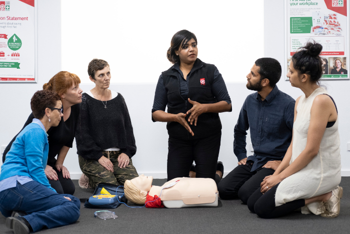 st john first aid training Trainer with students