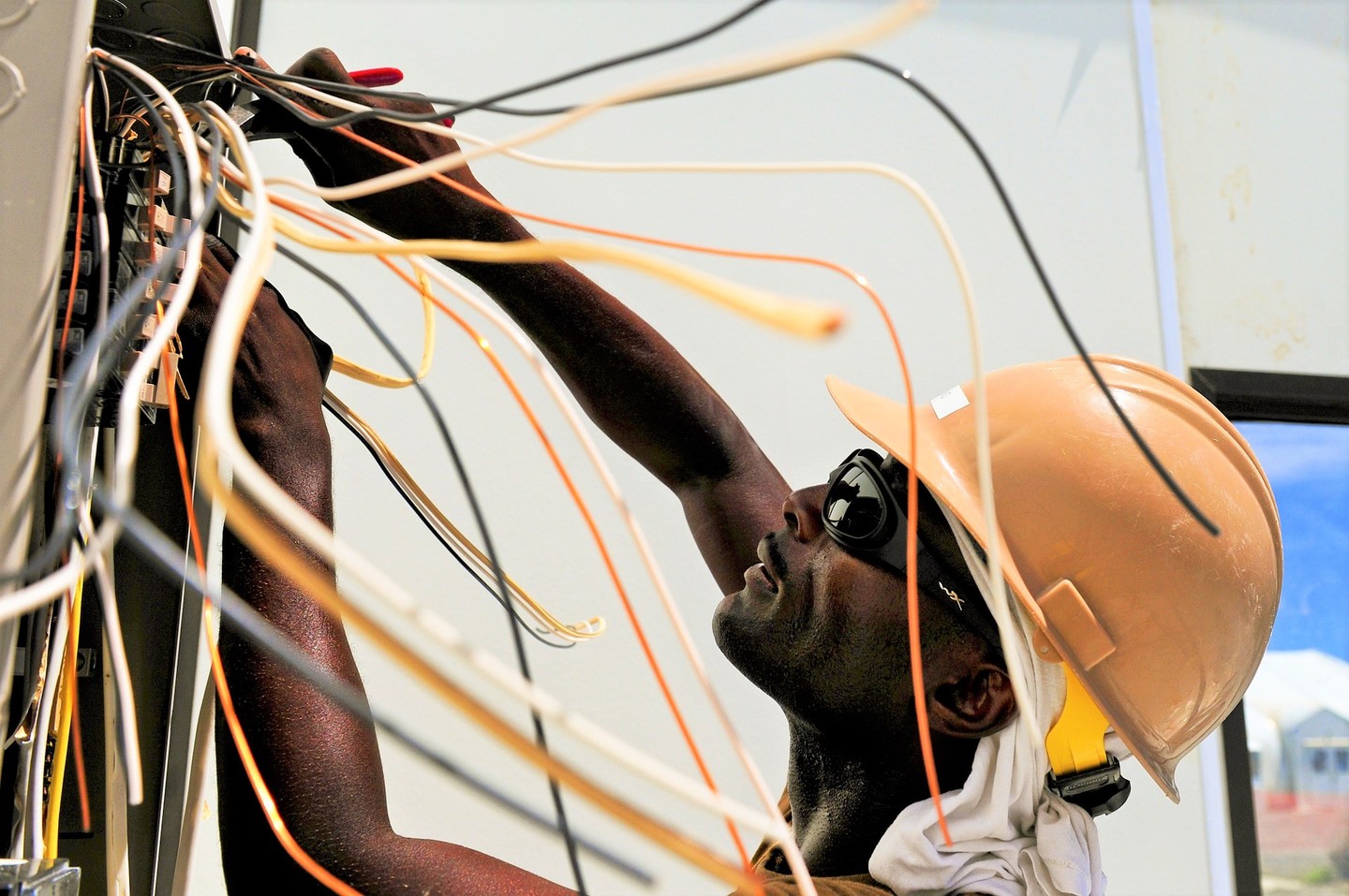 Electrical worker fixing wires